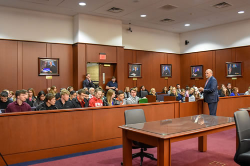 Chief United States District Judge Glenn T. Suddaby addresses the crowd at the March 21, 2019 Russo trial reenactment in Syracuse.