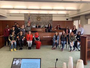 Henninger High School students, with United States District Judge Brenda K. Sannes